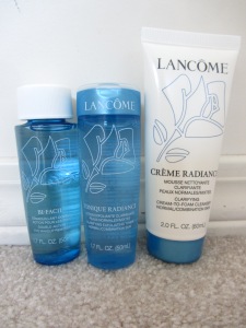 A three-piece skin care set: Double-Action Eye Makeup Remover (left), Clarifying Exfoliating Toner (middle), and Clarifying Cream-to-Foam Cleanser (right)